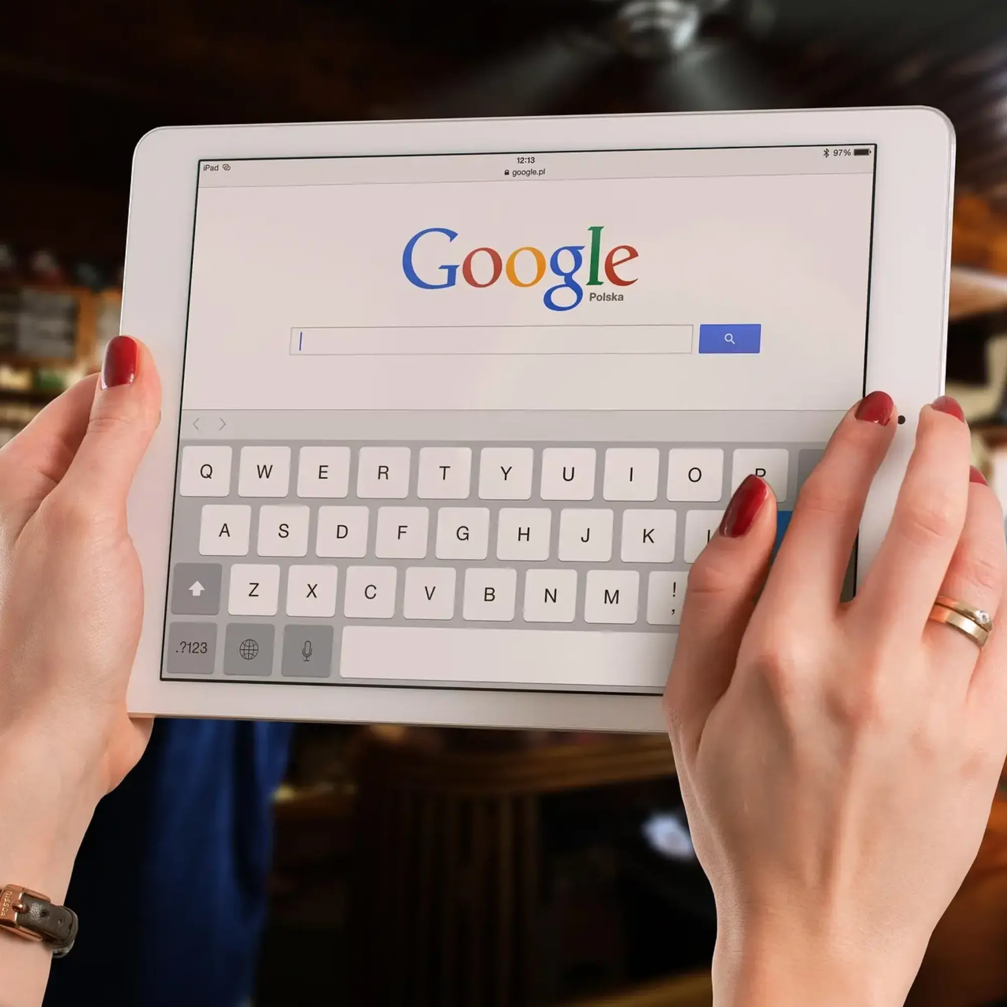 a person typing something on a search engine